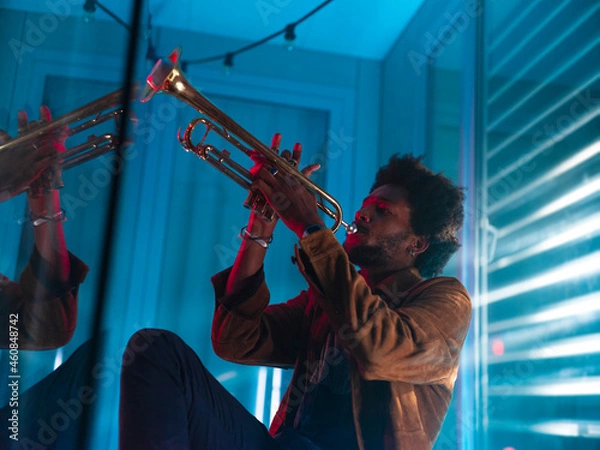 Obraz Young trumpeter performs at home