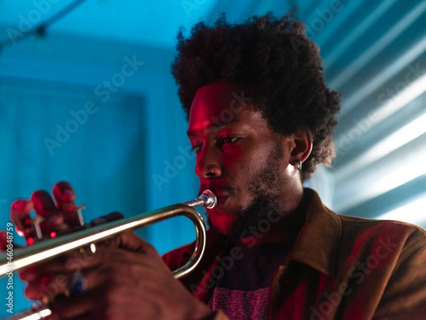 Obraz Young trumpeter performs at home