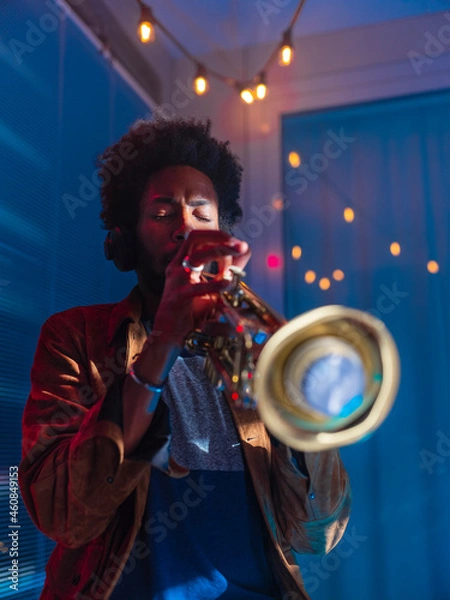 Obraz Young trumpeter performs at home