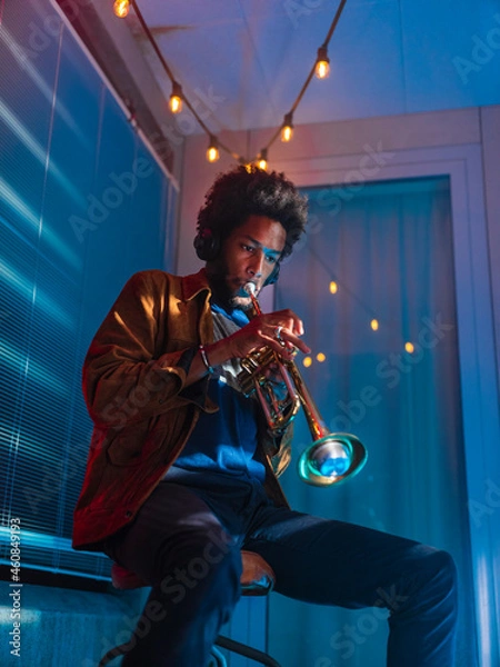 Obraz Young trumpeter performs at home