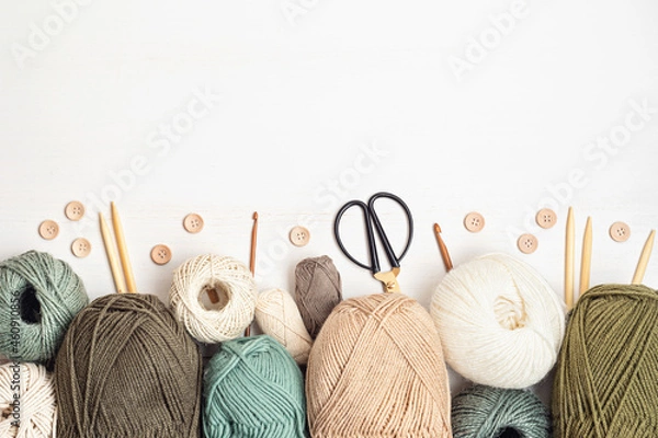 Obraz Craft hobby background with yarn in natural colors. Recomforting, destressing hobby for cold fall and winter weather. Mock up, copy space, top view