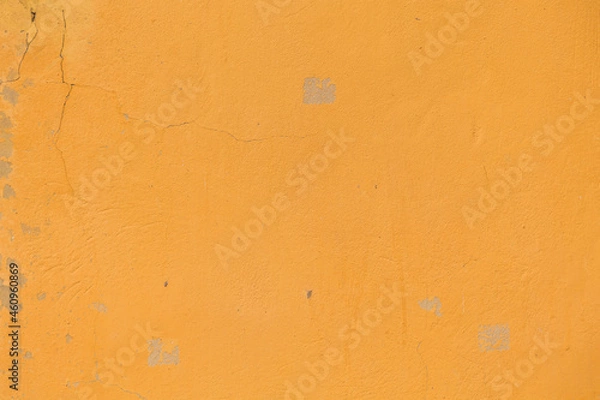 Fototapeta A yellow wall texture using for a background. 