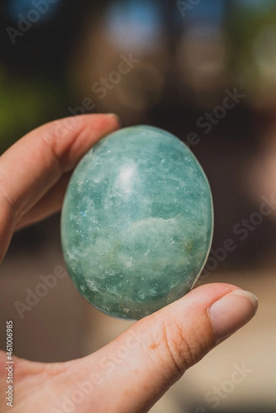 Obraz closeup of hand holding amazonite palm stone