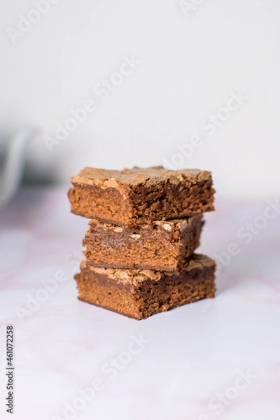Fototapeta closeup of tower of brownie cake slices ready to eat in the afternoon