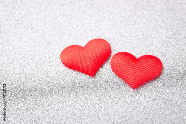 Obraz Two red hearts on silver background. Concept of love between people, devotion, romantic relationships