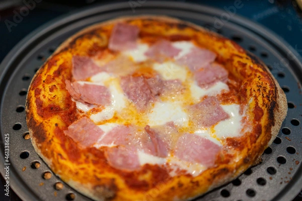 Obraz Homemade oven pizza with tomato sauce, mozzarella cheese, ham and parmesan.
