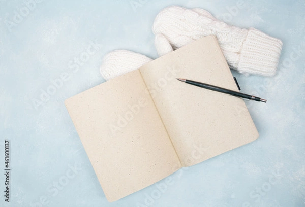 Fototapeta Open blank notebook wt a pencil and mittens