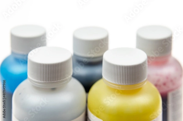 Obraz Five plastic bottles with different inks for ink-jet printer on a light background