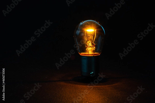 Obraz light bulb on a dark background
