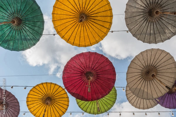 Obraz Paper Umbrella alley with blue sky in the background.