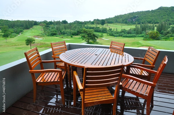 Fototapeta Chairs and table on wooden in a Green grass on a golf field