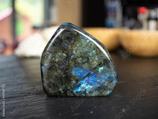 Obraz Labradorite mineral stone on slate worktop.