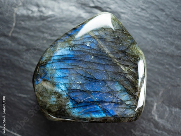 Obraz Labradorite mineral stone on slate worktop. Flat lay, top view.