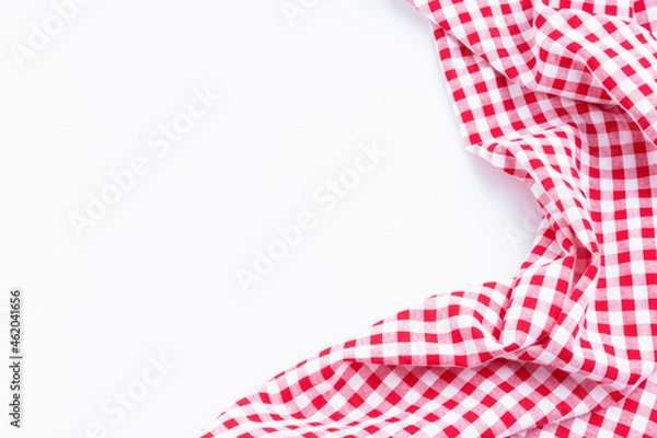 Fototapeta Checkers fabric crumpled top view with copy space. Red and white tablecloth texture picnic isolated on white background.
