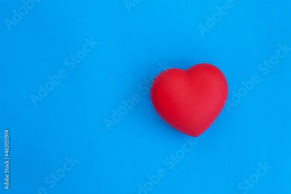 Obraz red heart on blue background