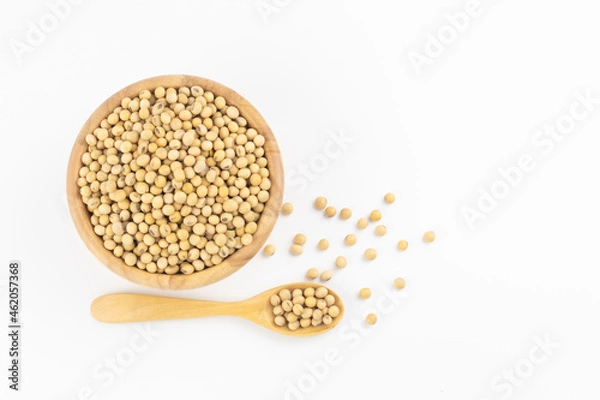 Fototapeta Soybean in wooden bowl and spoon on white background with free copy space 