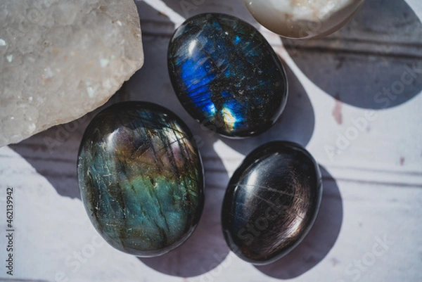 Obraz overhead photo of labradorite and hypersthene palm stones with flash
