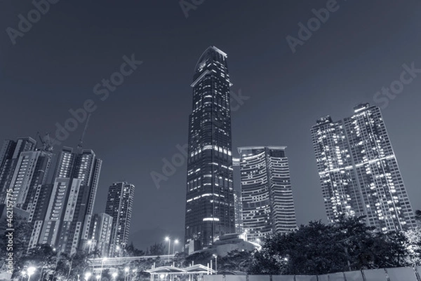 Fototapeta modern skyscraper and residential building in Hong Kong city at night