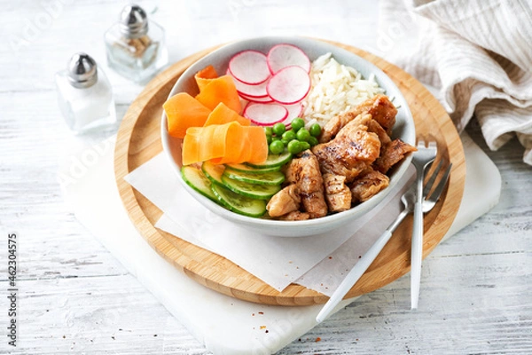 Fototapeta Healthy Vegan Poke bowl salad, heura vegetable protein, vegan chicken with variety vegetables, rice, served in bowl, light background. Copy space, selective focus. Lunch, vegetarian restaurant menu.