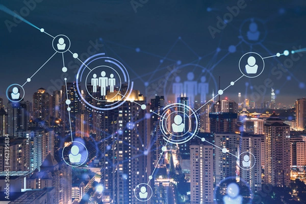 Fototapeta Glowing social media icons on night panoramic city view of Kuala Lumpur, Malaysia, Asia. The concept of networking and establishing new connections between people in businesses in KL. Double exposure.