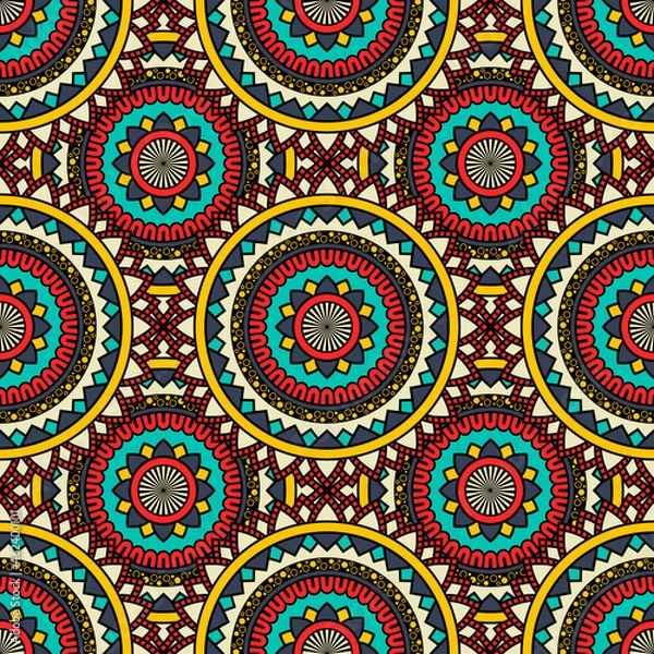 Fototapeta Abstract seamless backdrop. Round colorful texture in red, yellow and blue colors. Mandala background. Oriental pattern for design