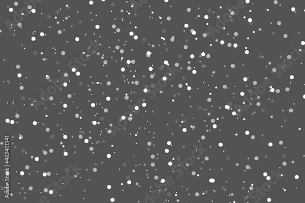 Fototapeta Abstract winter background from snowflakes blown away by the wind on  gray backdrop. White dust. Christmas background. Magic shining white dust. Fantastic shimmer effect