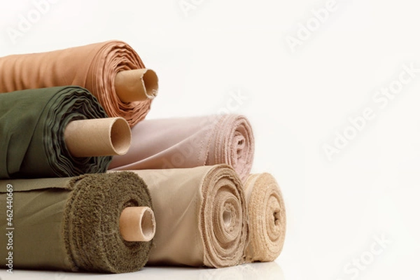 Fototapeta Rolls of pastel color fabric isolated on white