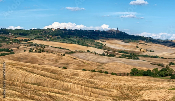 Fototapeta Tuscany, Italy. August 2020. Amazing landscape of the Tuscan countryside with the typical rolling hills and cypresses to mark the boundaries.