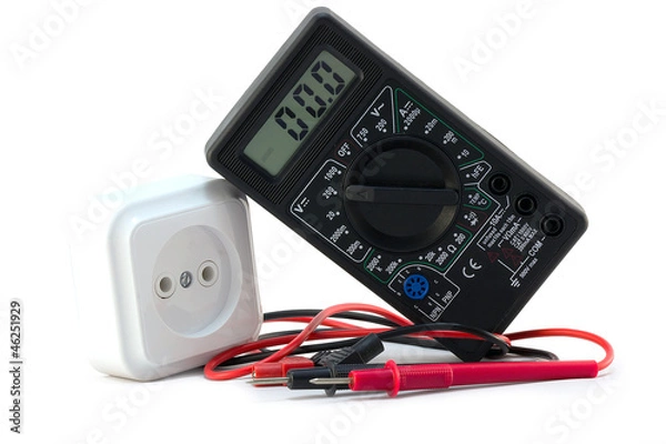 Obraz multimeter with electrical outlet on a white background