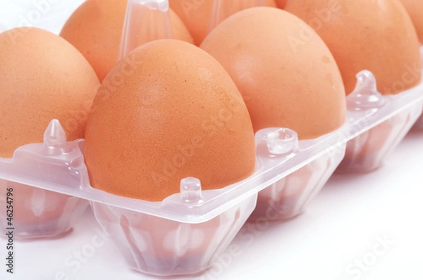 Fototapeta Eggs in plastic box