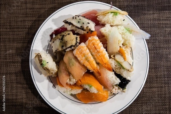 Fototapeta A plate of various kinds of fish sushi at a buffet restaurant, Japanese food