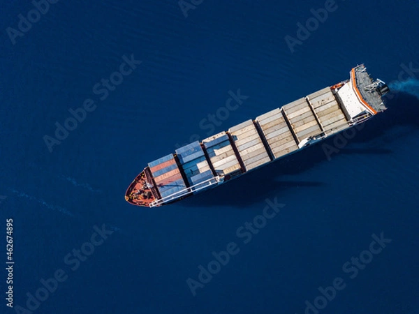 Fototapeta Aerial view on container ship shipping cargo. Export, import and logistic