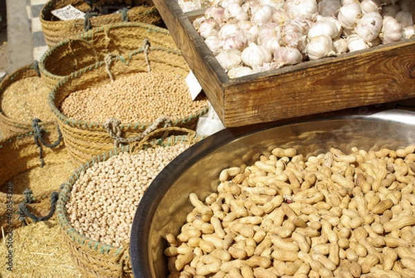 Fototapeta Monastir, Tunisia, Africa - August, 2012: Market stalls with spices and nuts in baskets in the medina of Monastir