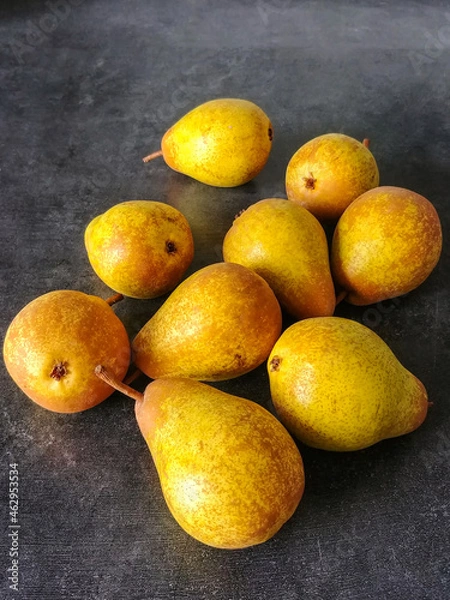 Obraz Yellow pears on a dark background