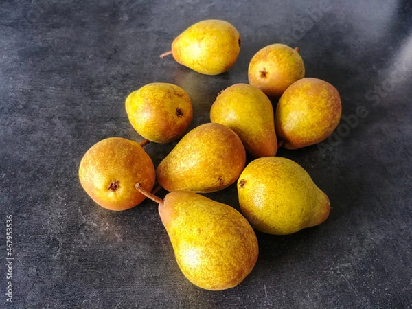 Obraz Yellow pears on a dark background