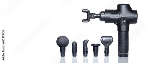 Fototapeta Percussion massager of deep muscle tissues for athletes, relaxes relieves pain. Handheld wireless professional therapeutic shock massage gun.   Massager attachments