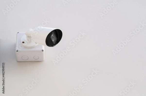 Fototapeta IP CCTV camera install on white concrete wall camera is home security system concept.