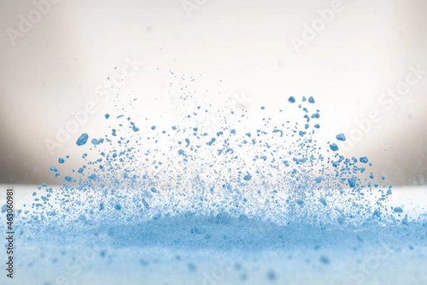 Fototapeta explosion of flour and components, lifting them into the air on a white surface