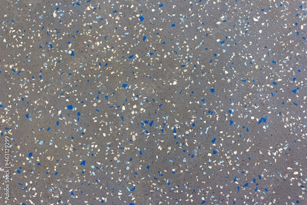 Obraz A gray surface with colored particles arranged randomly. Clusters of particles arranged randomly in space