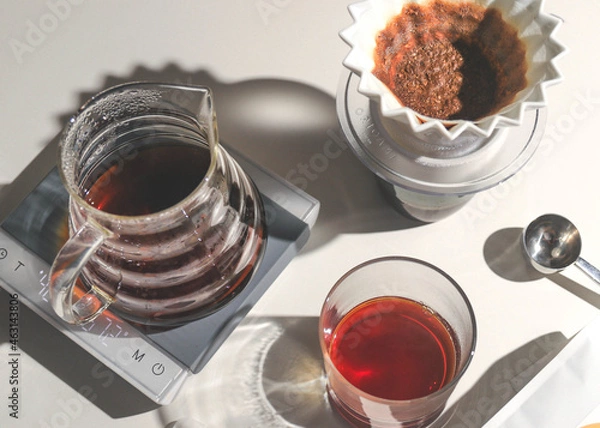 Fototapeta Filter coffee in a carafe with cup and brewer