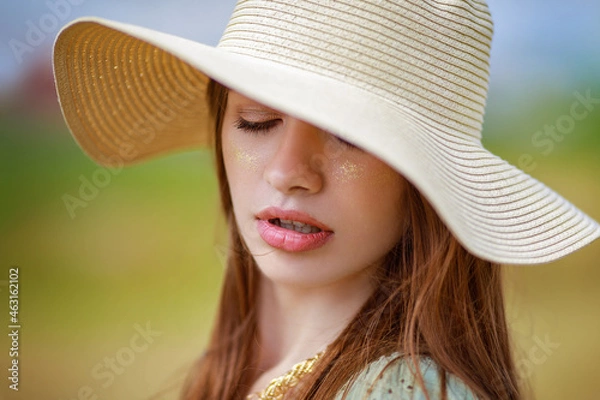 Obraz bright portrait in a hat sensual lips warm sunny background