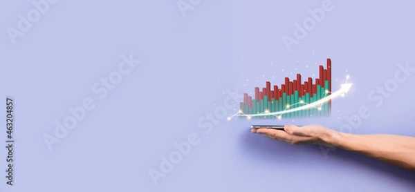 Fototapeta Male hand holding graph icon.checking analyzing sales data growth graph chart and stock market on global networking. Business strategy, planning and digital marketing