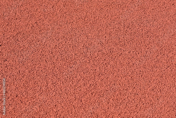 Fototapeta Texture of a rubber crumb for stadium. Rubber asphalt. Resilient coating for sports and athletics fields, jogging, running track and cycling paths