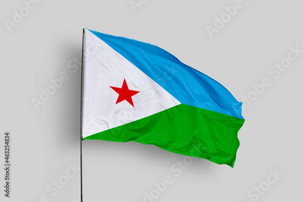 Fototapeta Djibouti flag isolated on the blue sky background. close up waving flag of Djibouti. flag symbols of Djibouti. Concept of Djibouti.