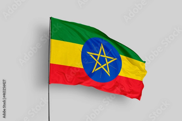 Fototapeta Ethiopia flag isolated on the blue sky background. close up waving flag of Ethiopia. flag symbols of Ethiopia. Concept of Ethiopia.
