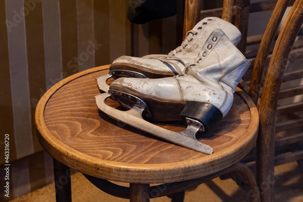 Fototapeta Retro skates on a wooden chair. the USSR.