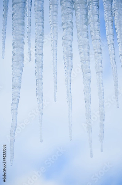 Obraz Icicles against blue sky