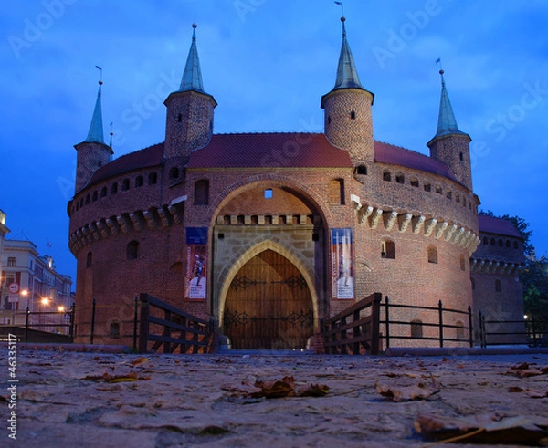 Obraz A gate to Krakow - barbican, Poland by night