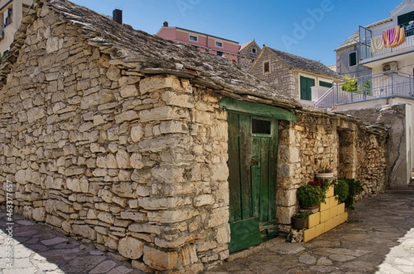 Obraz barn in the yard of a house in a Croatian village