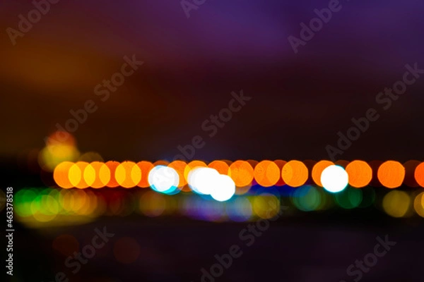 Fototapeta Abstract colored city lights in full focus with a beautiful correct bokeh